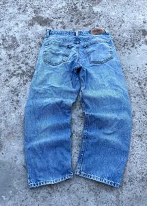 Distressed Blue Denim Jeans