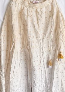 Biba’s Elegant White Palazzo Pants