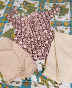 Maroon Floral short Kurta with cream Trousers