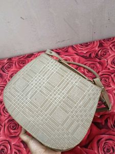 Gold sling bag