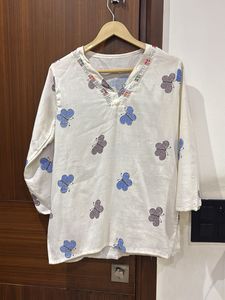white kurti with multicolored buttlerfy