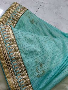 Elegant green Saree with Gold Border