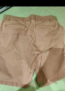 Green Tshirt with Tan shorts