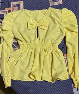 Chic Yellow Peplum Top with Bow Detail