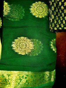 Elegant Green Saree with Gold Floral Motifs