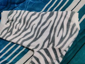 White Velvet Sweater With Black Stripes On It