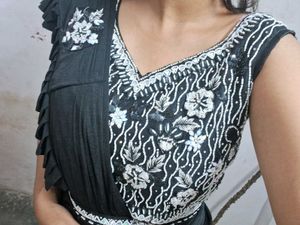 Selling a black color partywear stitched saree