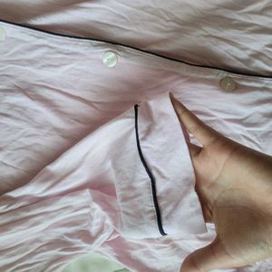 This Victoria's Secret satin pajama top features a