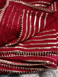Elegant Red Saree with Gold Embellishments