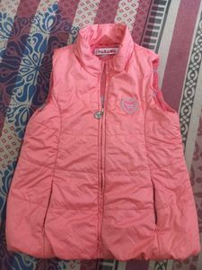 pink quilted sleeveless vest.
