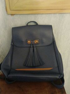 Blue leatherite backpack with magnetic shutters