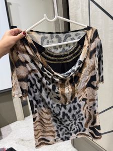 Chic Animal Print Top with Embellished Neckline