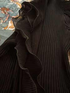 Chic Black Ribbed Mock Neck Top with Ruffle Sleeve