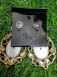Elegant Oval Earrings with Green Stones