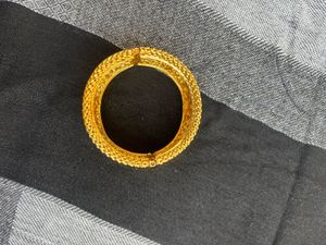 Traditional Gold Bangles with Intricate Floral De