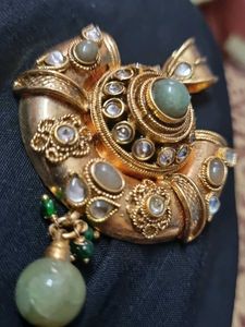 Designer Gold Tone Pendant with Green Stones