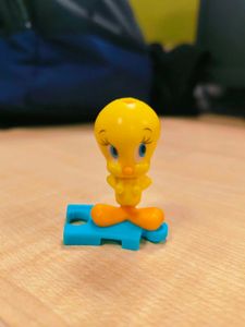 Cute Tweety Bird Toy Figure holding pink bag pack,