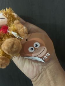 This is a fluffy orange-brown orangutan plush