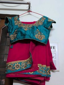 Elegant Red Saree with Green  Embroidery