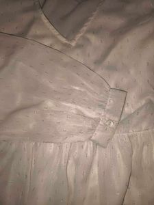 Sheer white peplum top with bell sleeves