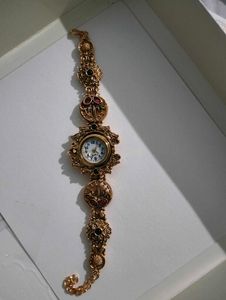 Exquisite Gold Tone Watch with Gemstones