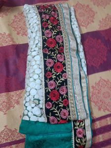 Elegant Teal Saree with Intricate Border