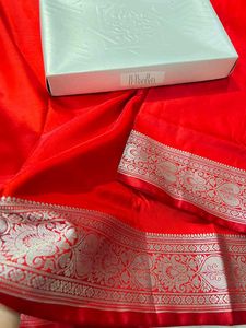Vibrant Red Silk Saree with Intricate Silver Borde