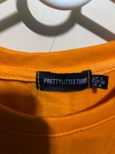 PrettyLittleThing “Wyoming” Cropped Sweatshirt