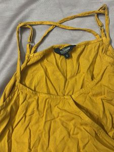 cute mustard sleeveless peplum top