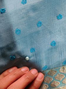A Nice Sky Blue Saree With Beads