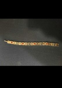 Elegant Gold-Tone Bracelet with Charm Accents