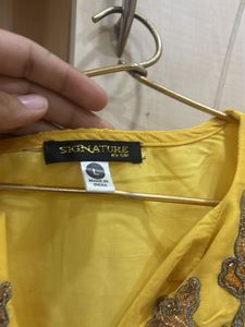 Yellow Embroidered kurta with skirt