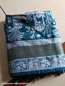 Elegant Teal Saree with Intricate Designs