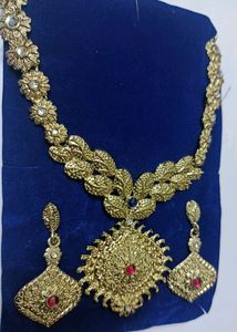 Golden Jewellery With Pink Stones