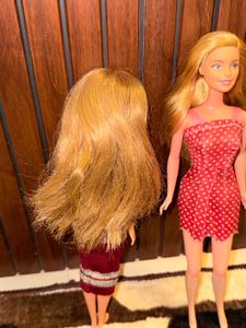Two barbie dolls