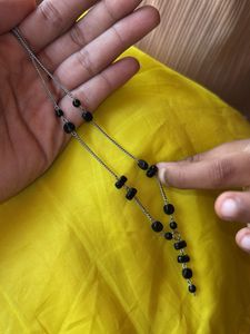 Elegant Silver Necklace with Black Beads
