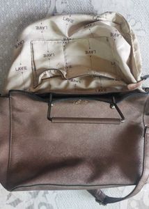 Chic Bronze Textured Handbag with Dual Straps