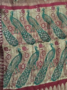 Beautiful Orange Silk Saree with Peacock Border