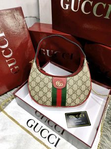 GUCCI* *GG MARMONT HALF-MOON-SHAPED MINI BAG*