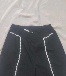 Chic Black Wide-Leg Pants with White Trim