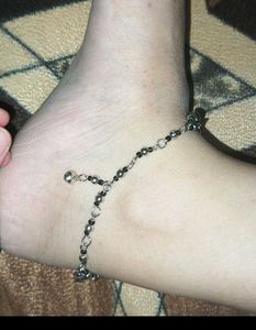 Anklet with black beads and charms