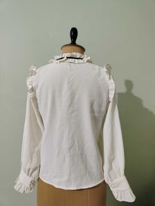 Ruffled White Blouse with Black Bow