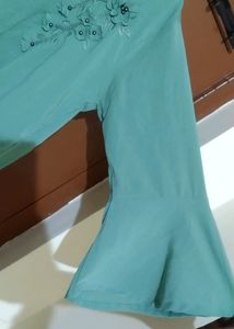 Aqua Green Top With Embroidery Design In The Front And Bell Sleeve