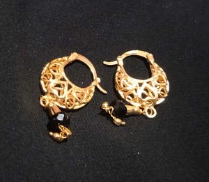 Elegant Gold Jhumka Earrings with Black Stone