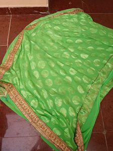 Vibrant lehenga Green Saree with Gold Border