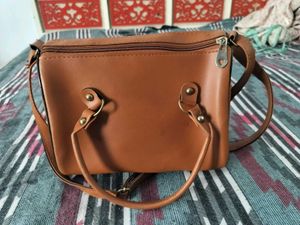 sale on Stylish Textured Brown sling Bag