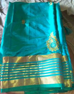 Stunning Teal Saree with Gold Border