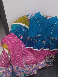 1) Royal Blue Lehenga Choli with Red Dupatta.  2)