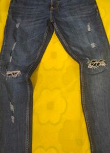 Distressed Blue Denim Jeans