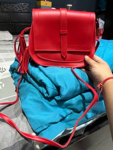Red Sling Bag With Tassel Detailing